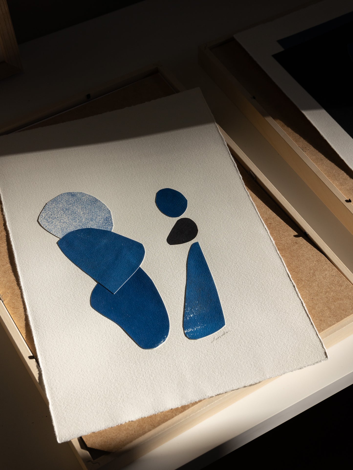 Original collage and cyanotype abstract artwork representing two figures, light and shadow