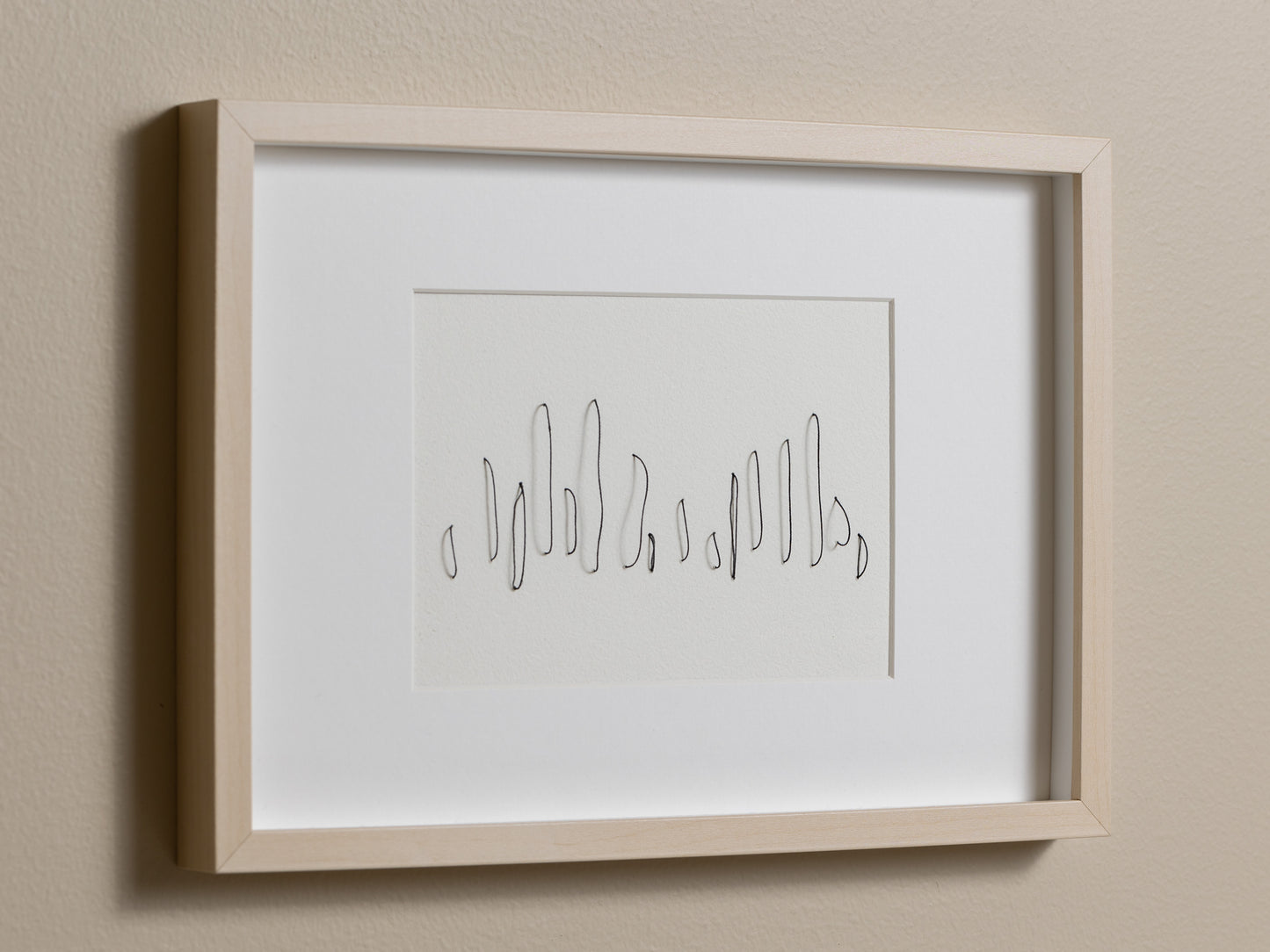 Framed abstract embroidery on paper, an original minimalist relief artwork that changes with the light, angled