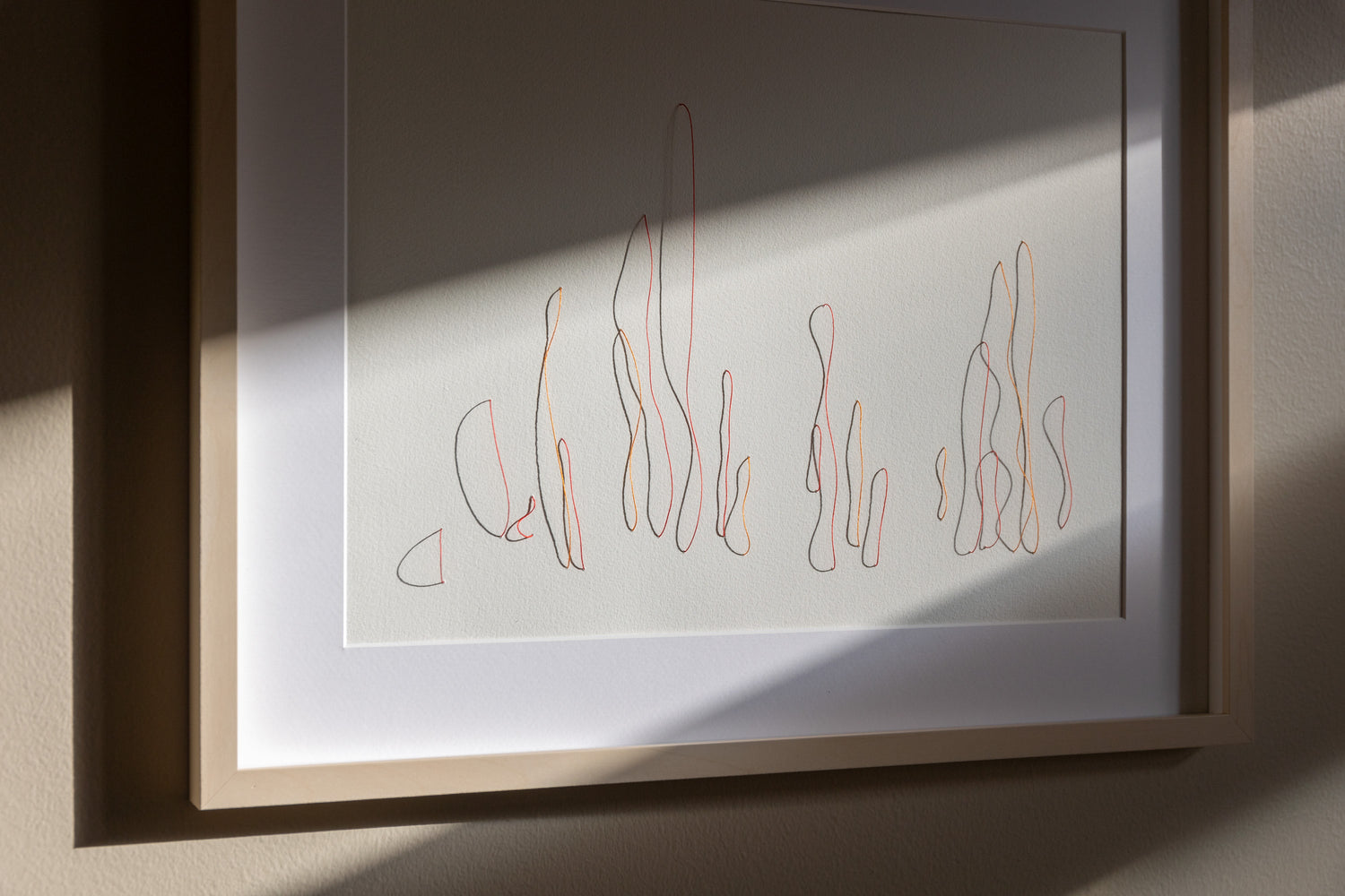 Original framed embroidery on paper, showcasing intricate relief that changes with light.