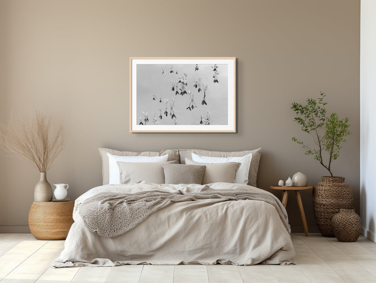 Black and white fine art photography print featuring a peaceful lake, displayed in an interior setting, available as wall art with framing options.