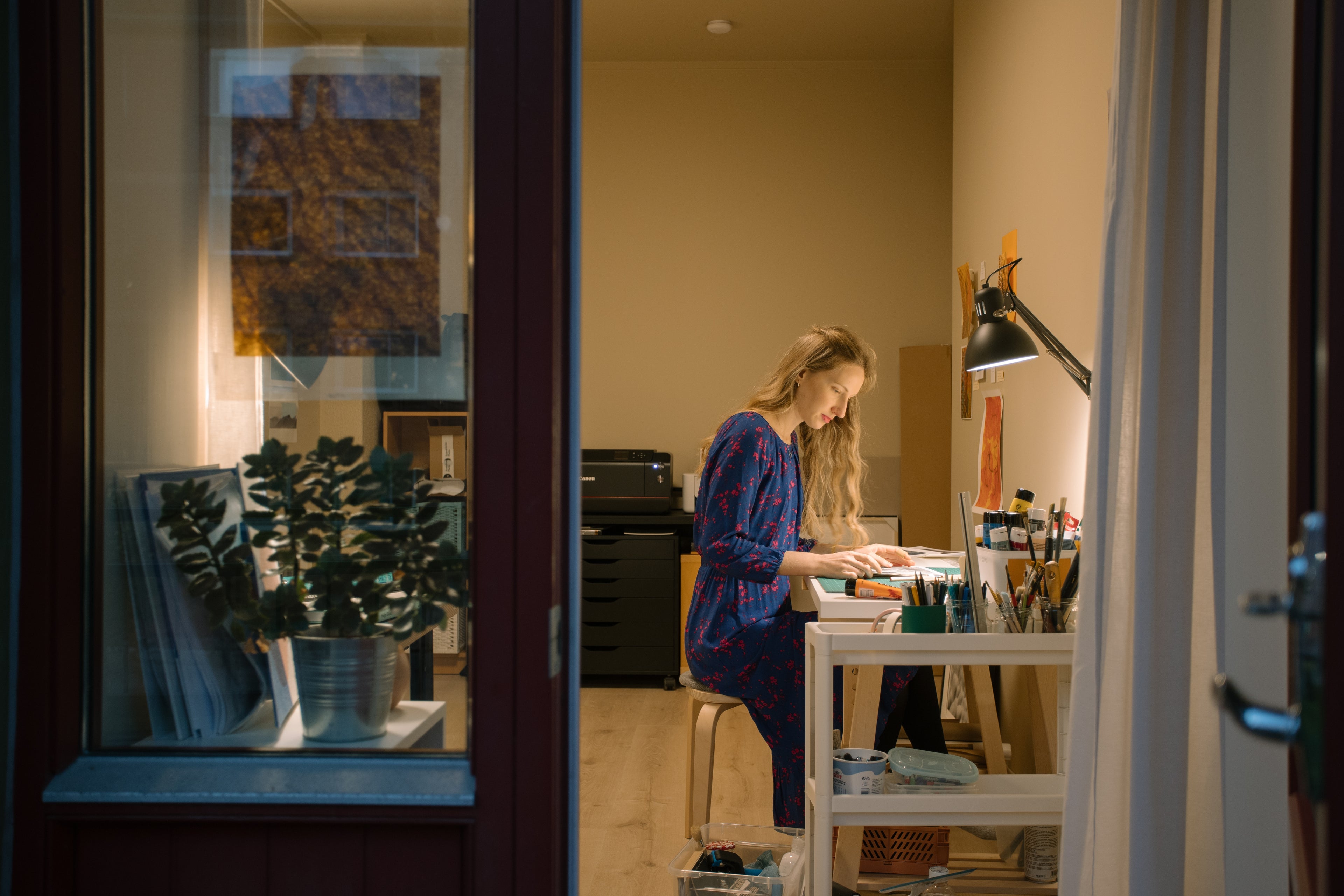 Lili Zaneta working ion photography prints in her studio space