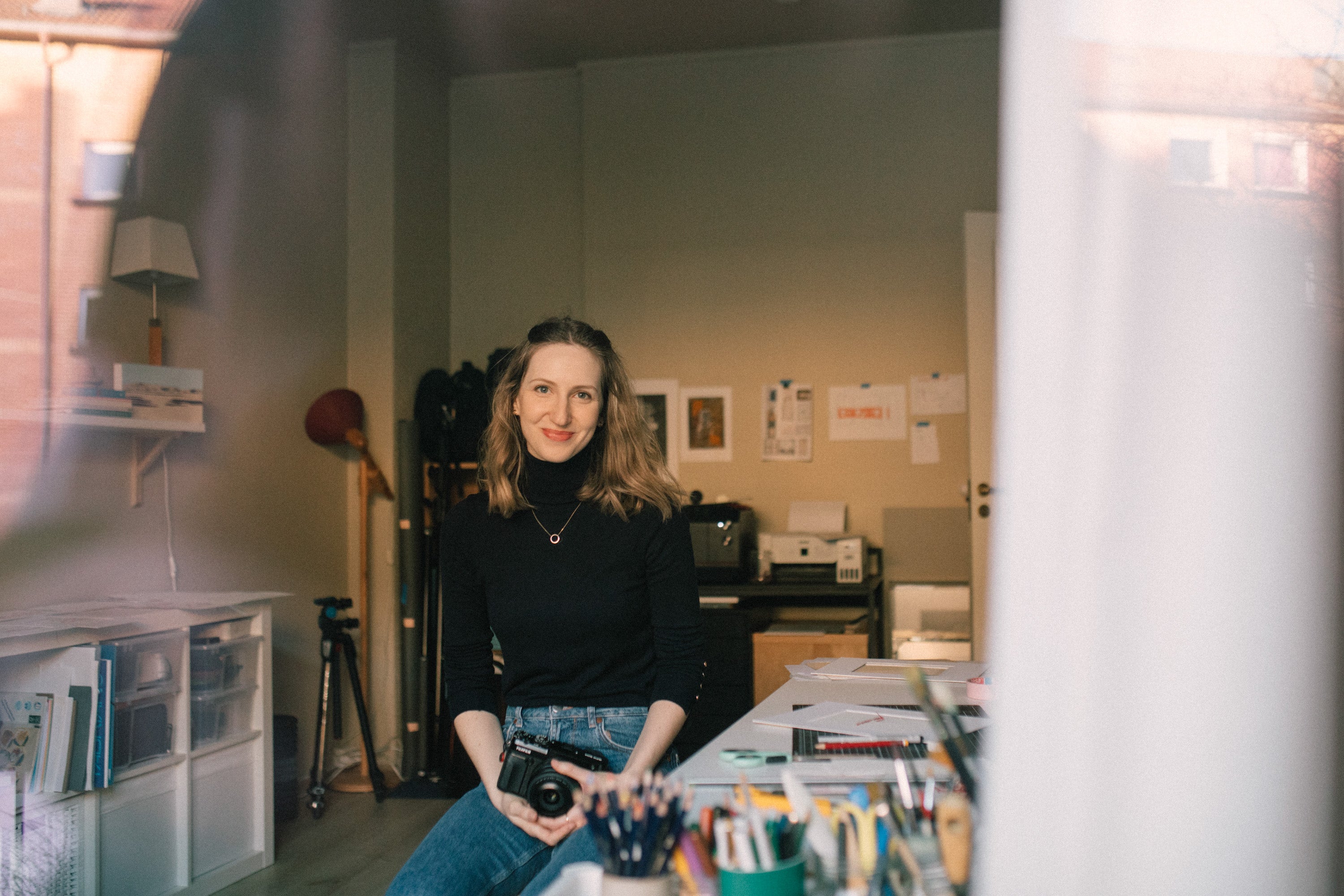 Artist in her studio working