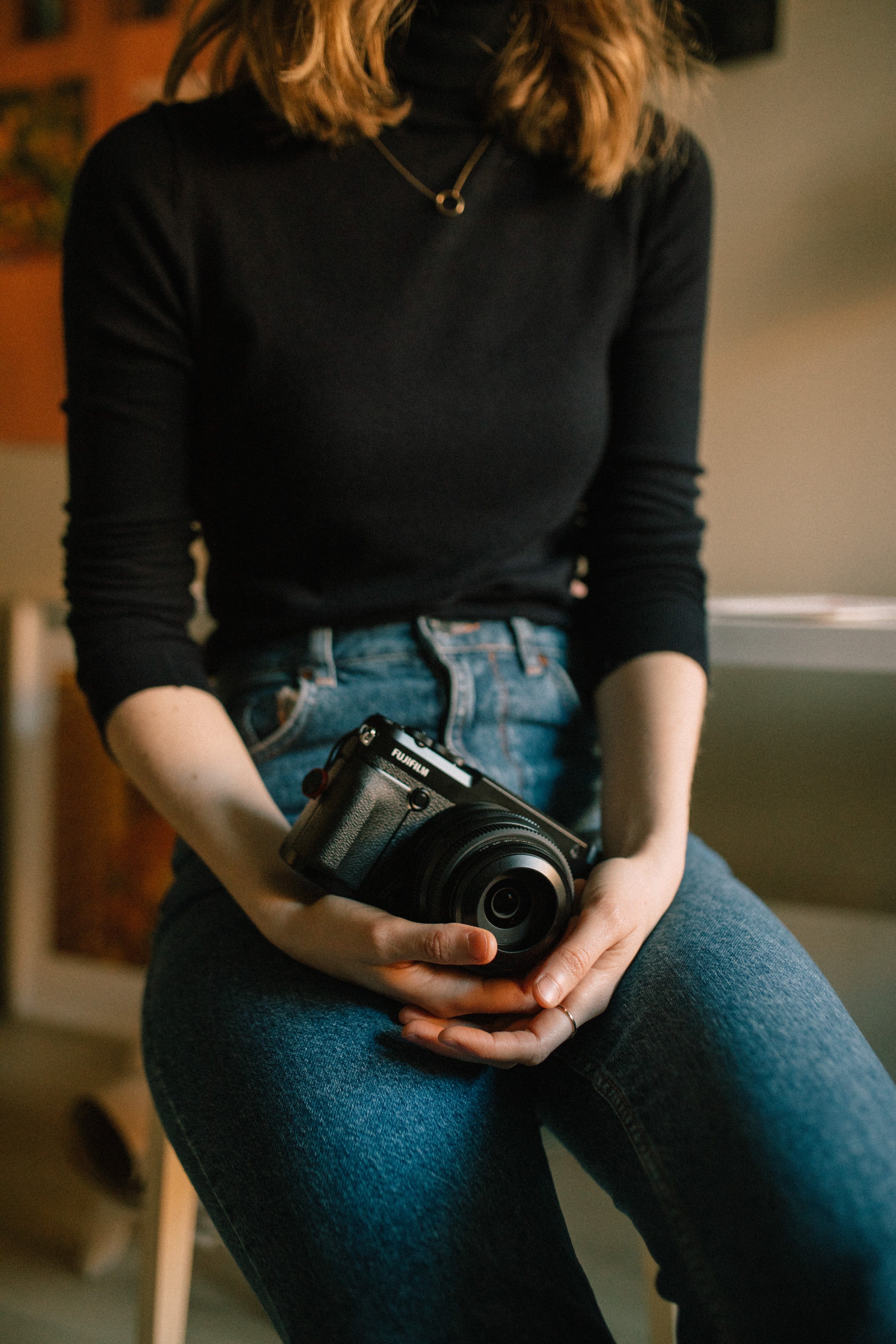 Photographer with her camera in art studio