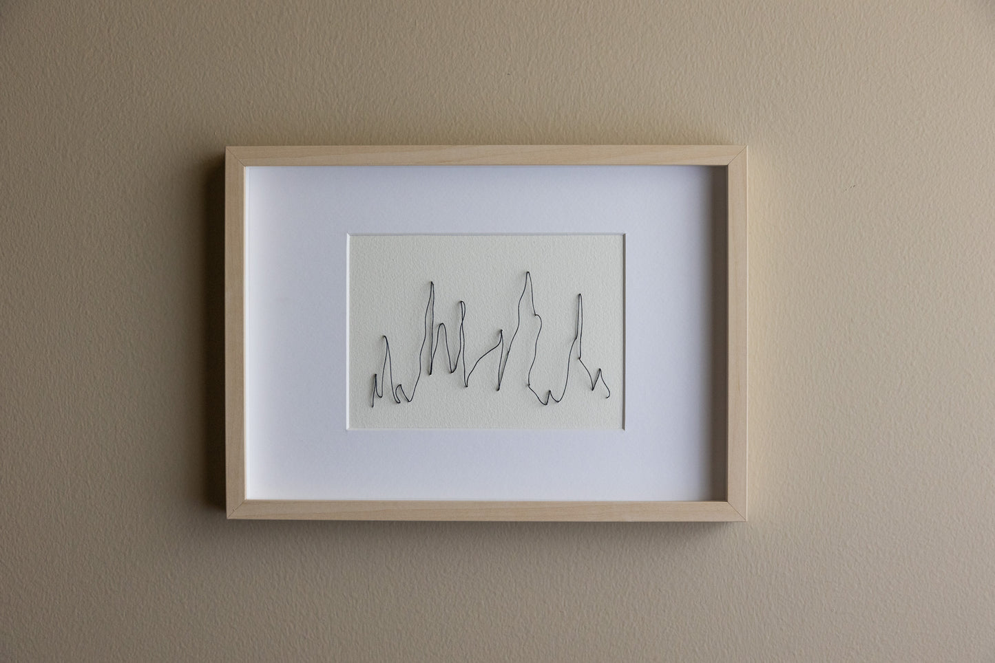 Framed abstract and minimalistic embroidery on paper, an original minimalist artwork that changes with the light, soft light