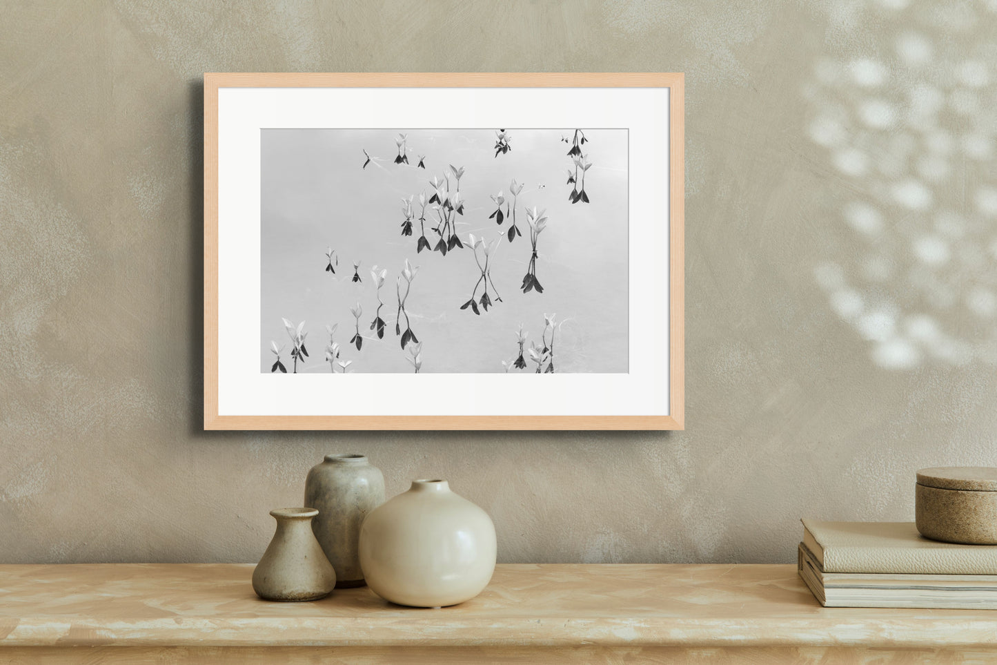 Black and white fine art photography print featuring a peaceful lake, displayed in an interior setting, available as wall art with framing options.