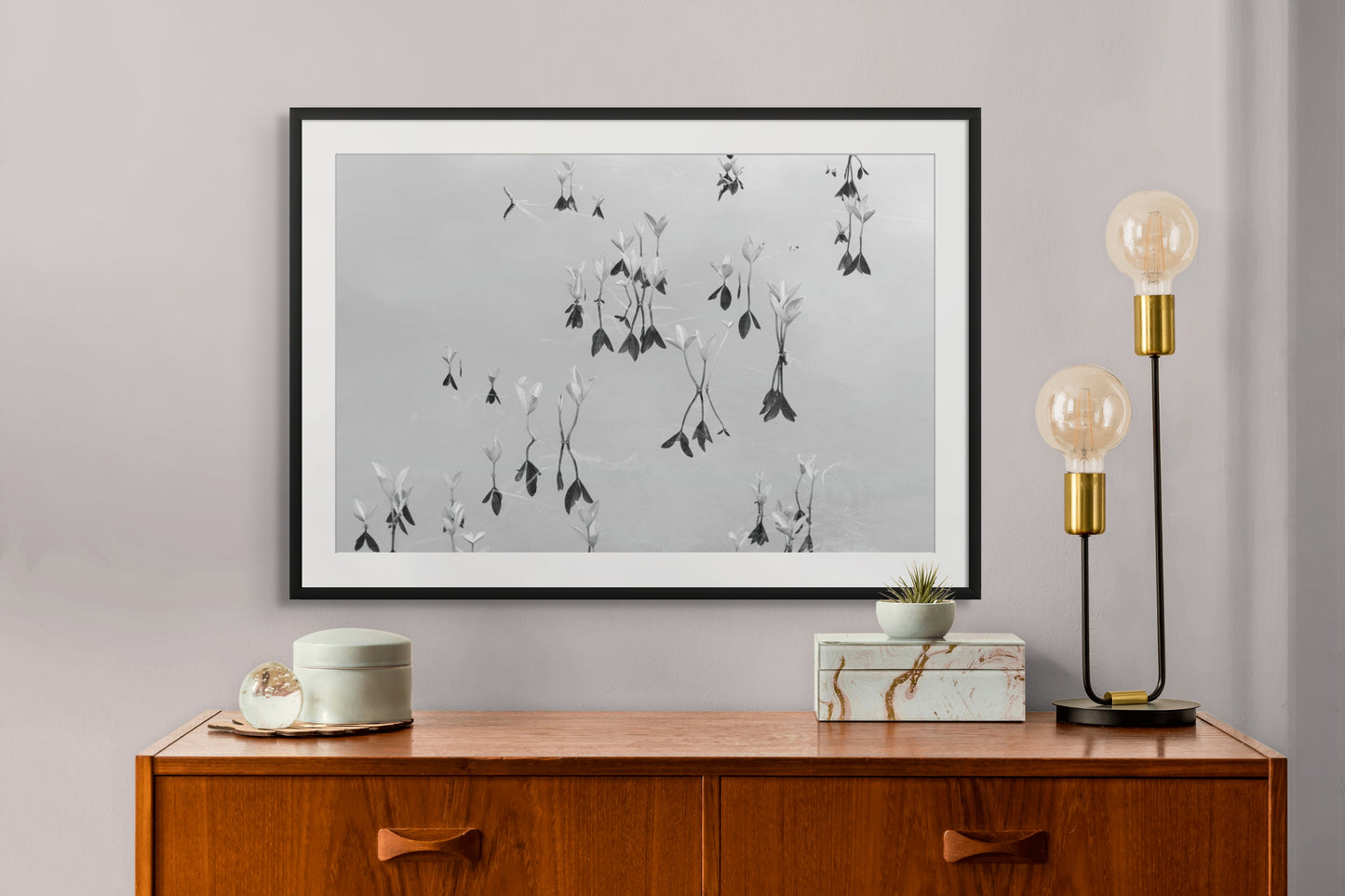 Black and white fine art photography print featuring a peaceful lake, displayed in an interior setting, available as wall art with framing options.