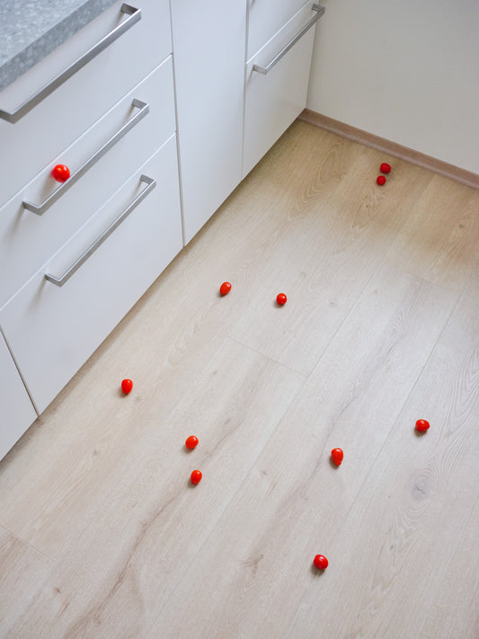Still-life photography featuring tomatoes on the kitchen floor. Limited edition photography print.