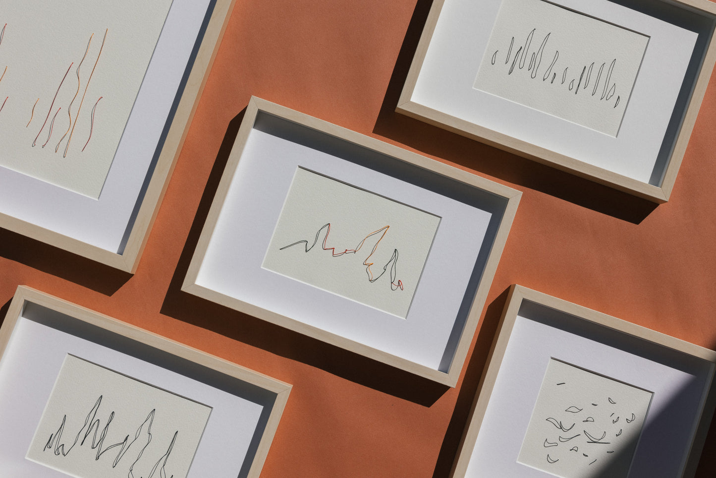 Framed abstract embroideries on paper, original minimalist artworks that change with the light and create shadows