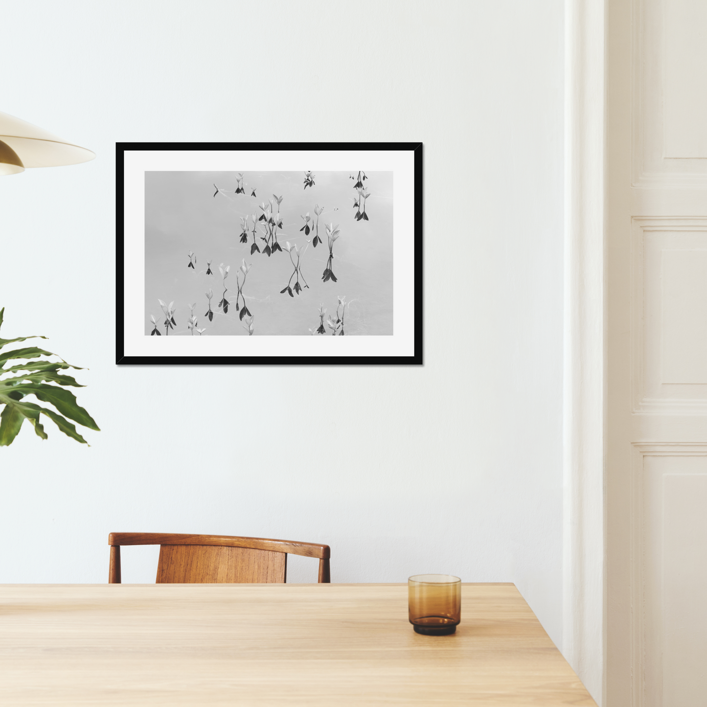 Black and white fine art photography print featuring a peaceful lake, displayed in an interior setting, available as wall art with framing options.