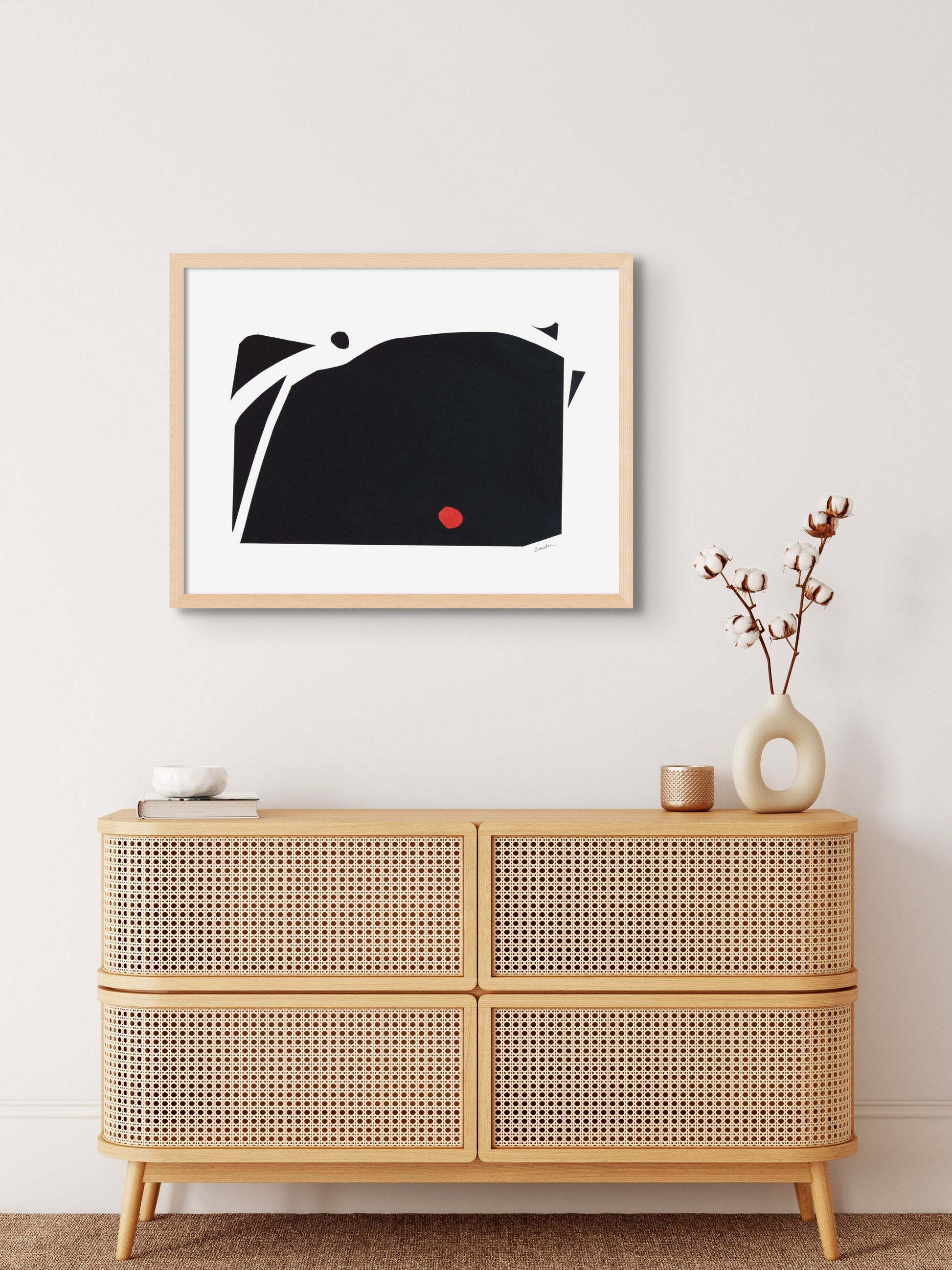 Art print featuring abstract black and red shapes representing mountains, displayed in a minimalistic interior setting, available as a Giclée print with framing options."