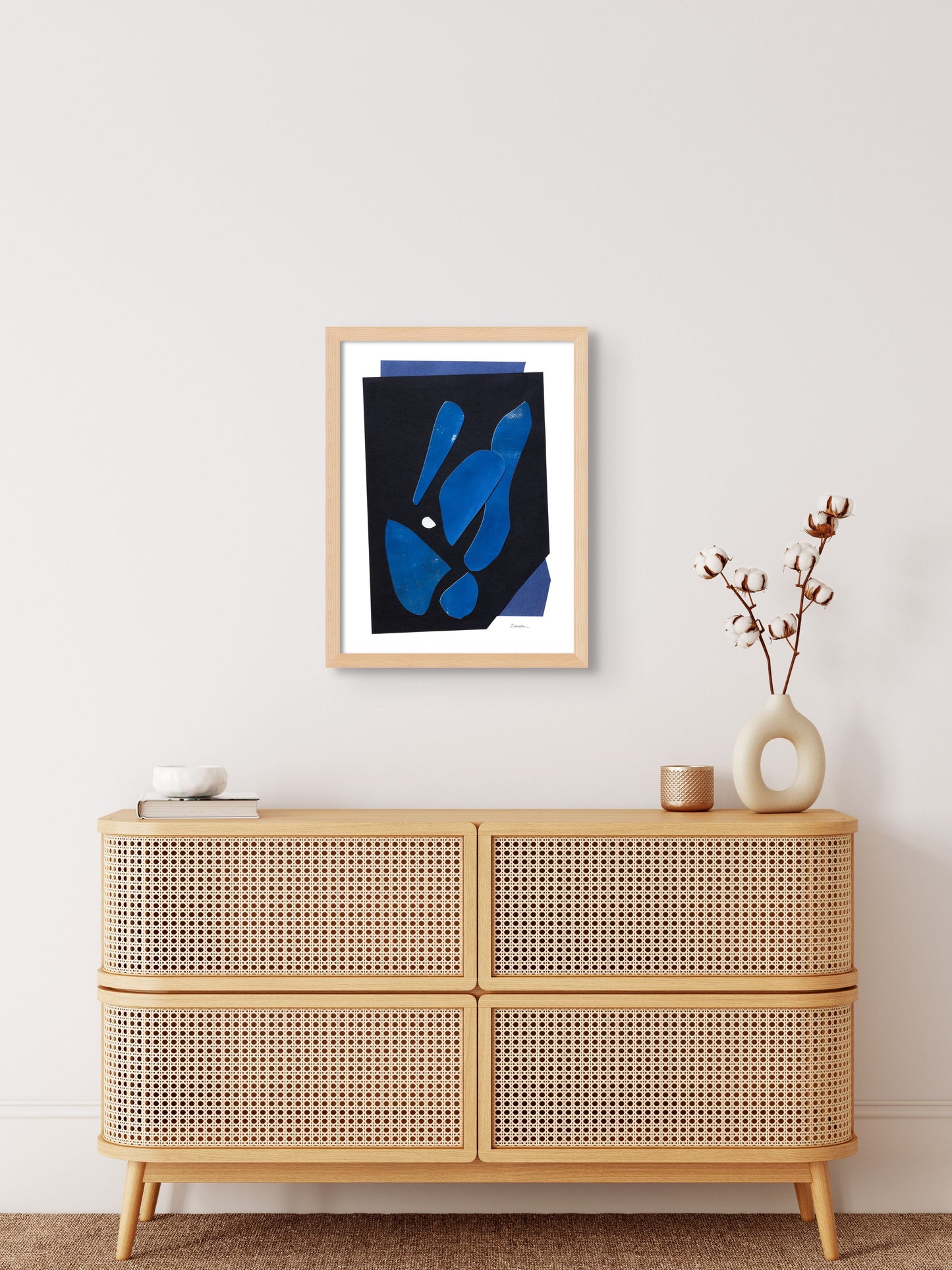 Art print featuring abstract black and blue shapes, displayed in an minimalistic interior setting, available as a Giclée print with framing options.