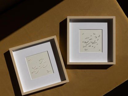 Framed abstract embroidery on paper, original minimalist relief artworks representing birds, changing with the light.