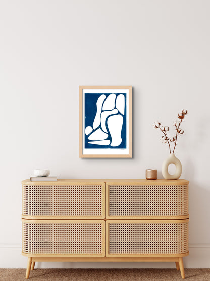 Art print featuring abstract white and blue shapes, displayed in an interior setting, available as a Giclée print with framing options.