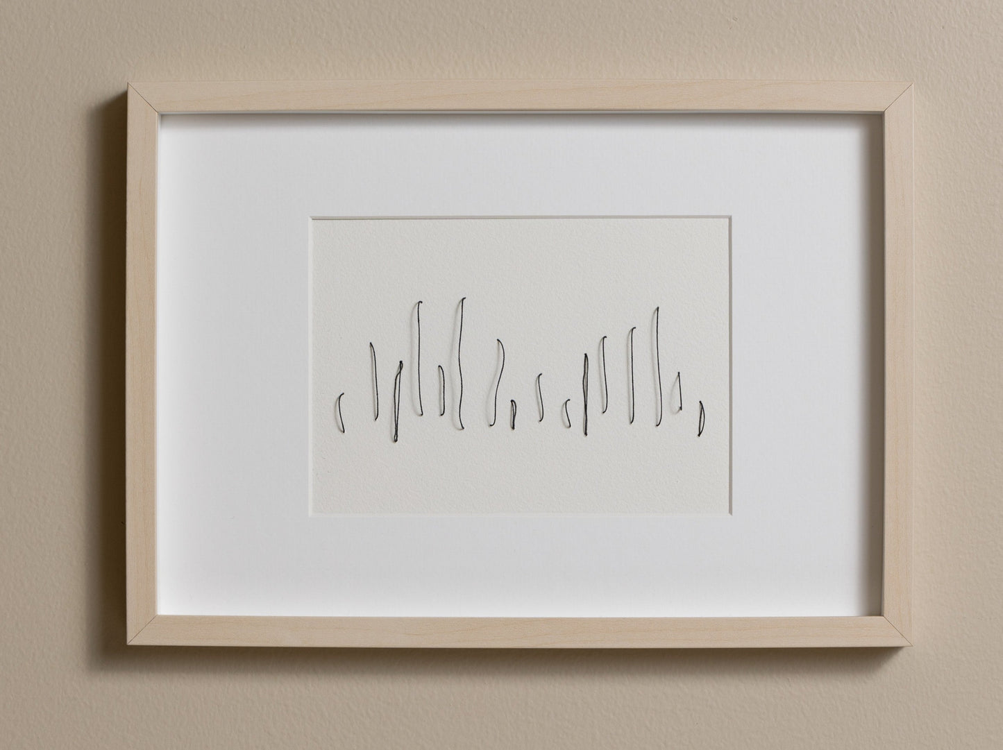 Framed abstract embroidery on paper, an original minimalist relief artwork that changes with the light.