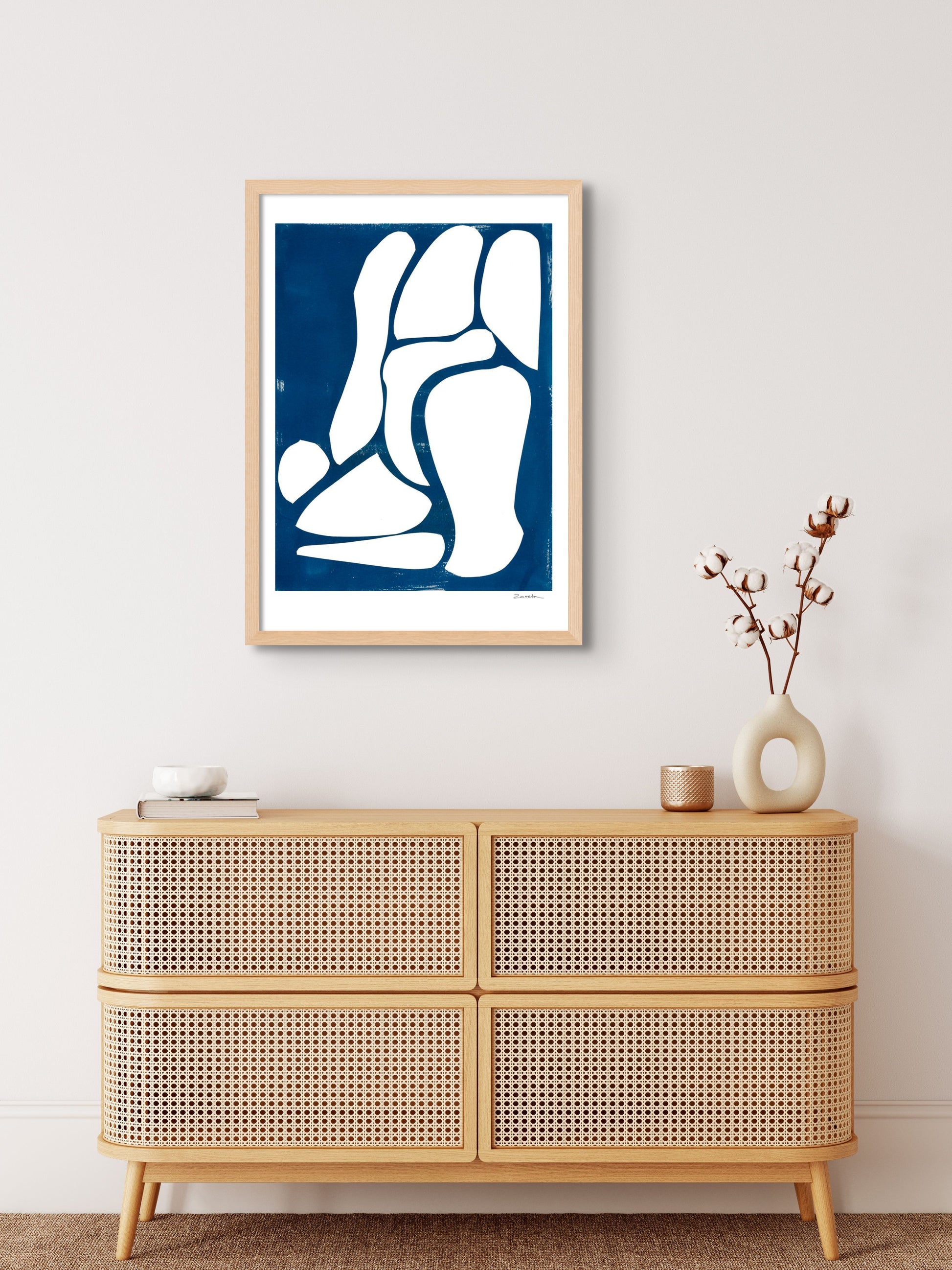 Art print featuring abstract white and blue shapes, displayed in a minimalistic interior setting, available as a Giclée print with framing options.