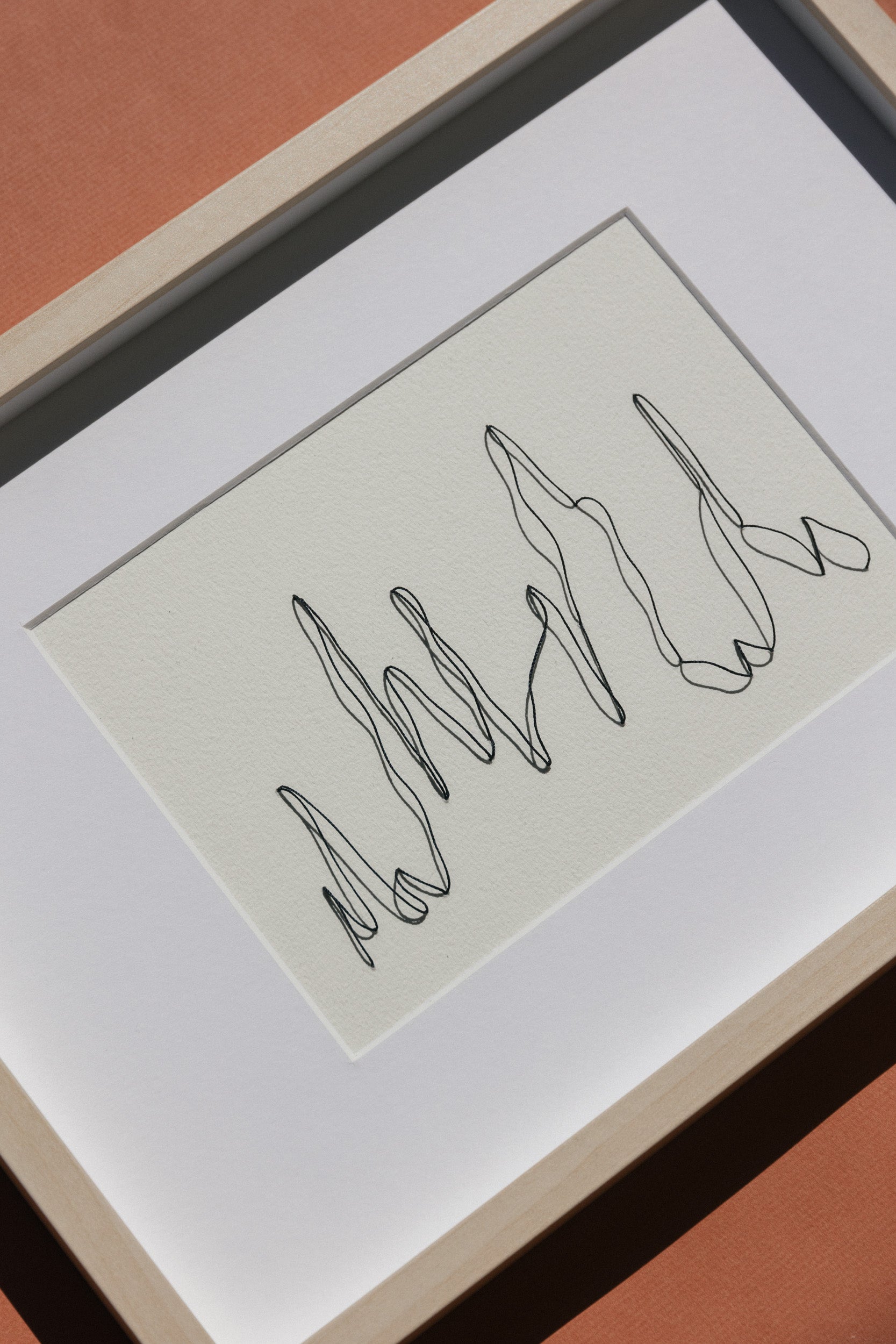 Framed abstract and minimalistic embroidery on paper, an original minimalist artwork that changes with the light, detail