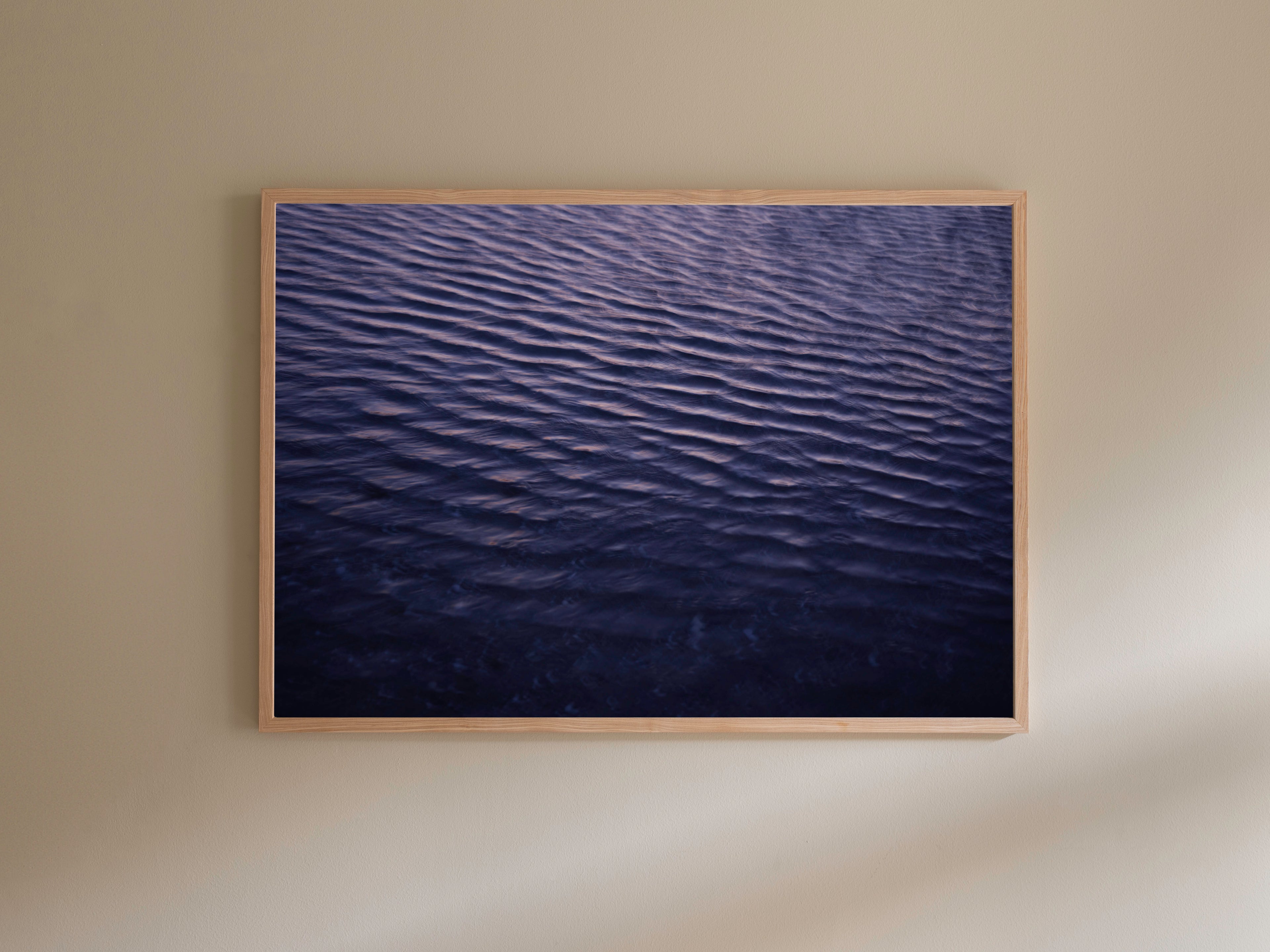 Fine art photography print featuring the purple-colored sea, available as wall art with framing options.