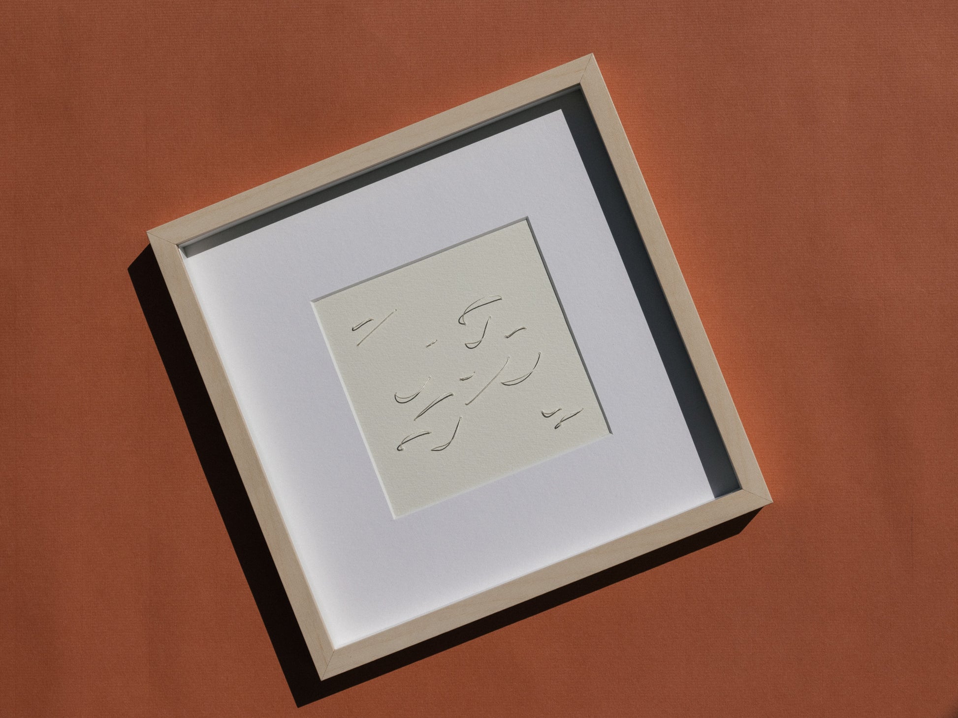 Framed abstract embroidery on paper, an original minimalist relief artwork representing white birds, changing with the light.