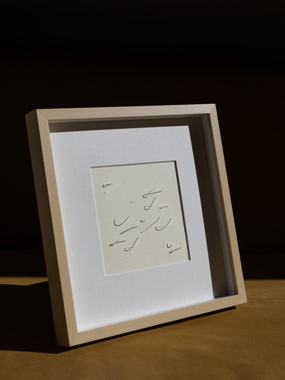 Framed abstract embroidery on paper, an original minimalist relief artwork representing white birds, changing with the light, angled