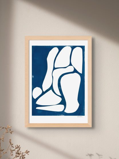 Art print featuring abstract white and blue shapes, displayed in an interior setting, available as a Giclée print with framing options.